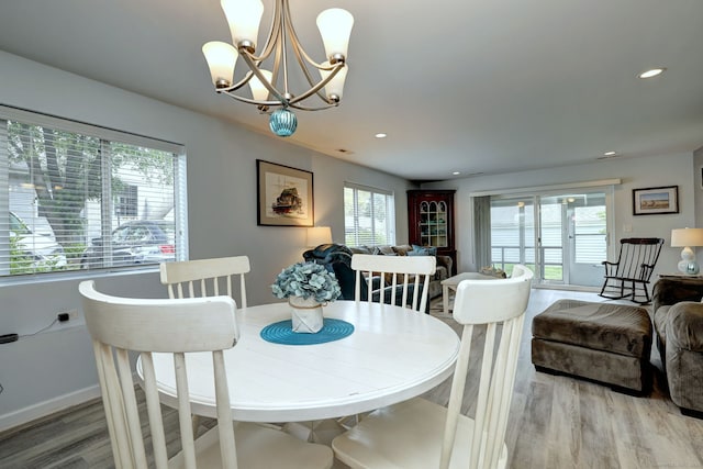 267 Melba St Apt D2, Milford, CT 06460 - dining space with light wood finished floors, a chandelier, and recessed lighting