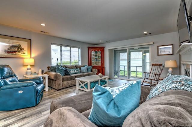 267 Melba St Apt D2, Milford, CT 06460 - living area featuring plenty of natural light, wood finished floors, and recessed lighting