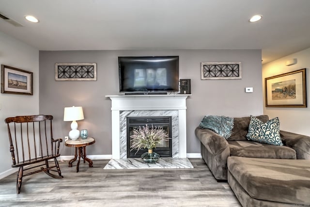 267 Melba St Apt D2, Milford, CT 06460 - living area featuring wood finished floors, recessed lighting, and a high end fireplace
