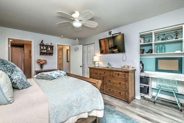 267 Melba St Apt D2, Milford, CT 06460 - bedroom with wood finished floors, a desk, a ceiling fan, and a closet
