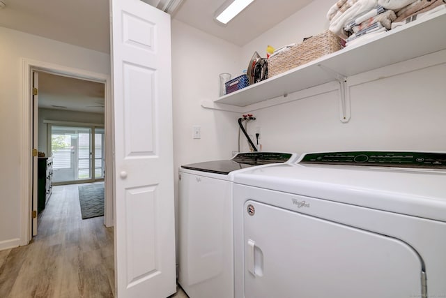 267 Melba St Apt D2, Milford, CT 06460 - washroom featuring washer and dryer and light wood-type flooring