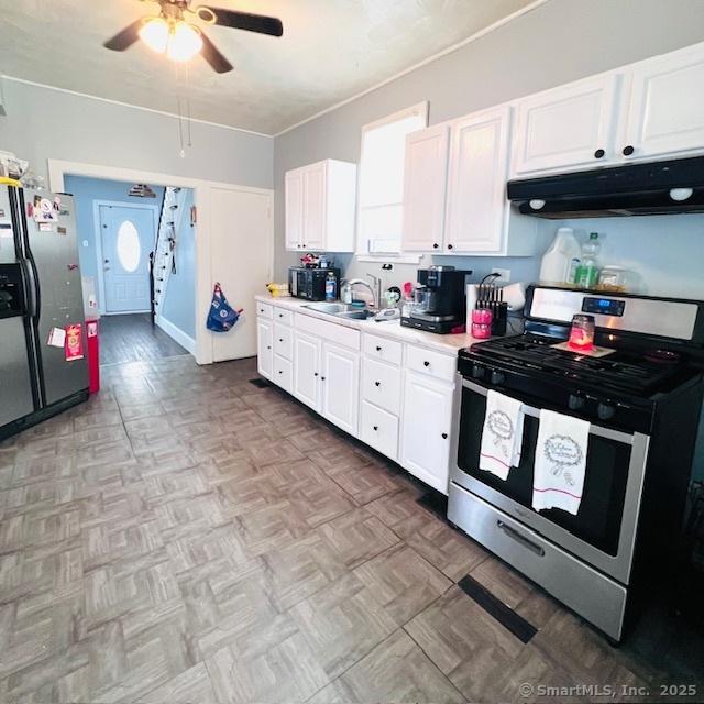 22 Webb St, Hamden, CT 06517 - kitchen featuring stainless steel appliances, under cabinet range hood, ceiling fan, white cabinets, and light countertops