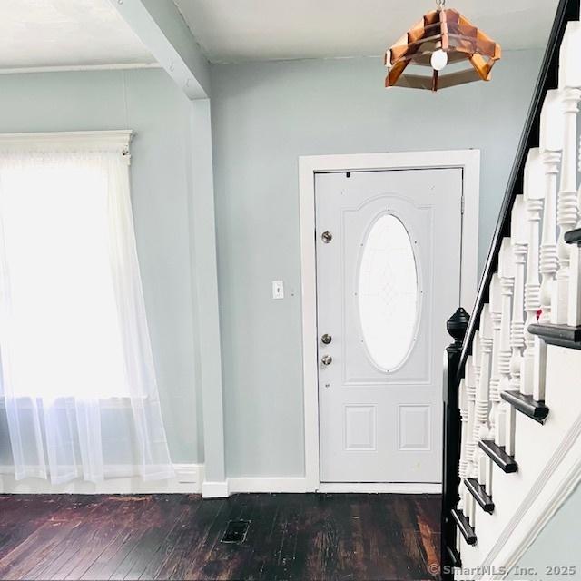22 Webb St, Hamden, CT 06517 - foyer with stairway, dark wood-style floors, and baseboards