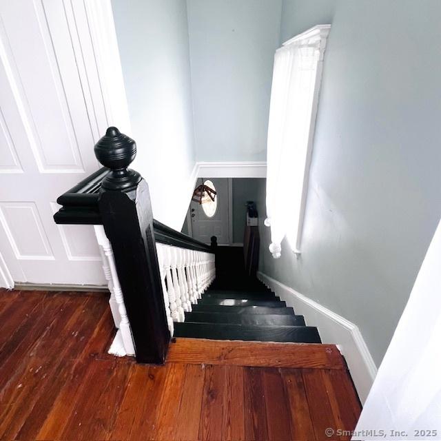22 Webb St, Hamden, CT 06517 - stairway featuring hardwood / wood-style flooring and baseboards