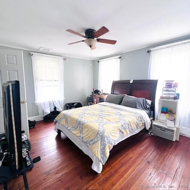 22 Webb St, Hamden, CT 06517 - bedroom with wood-type flooring, multiple windows, crown molding, and ceiling fan