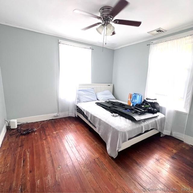 22 Webb St, Hamden, CT 06517 - bedroom with dark wood-style flooring, baseboards, crown molding, and ceiling fan