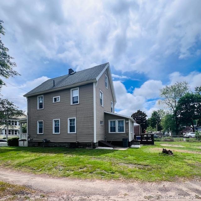 22 Webb St, Hamden, CT 06517 - view of property exterior with a lawn and a chimney