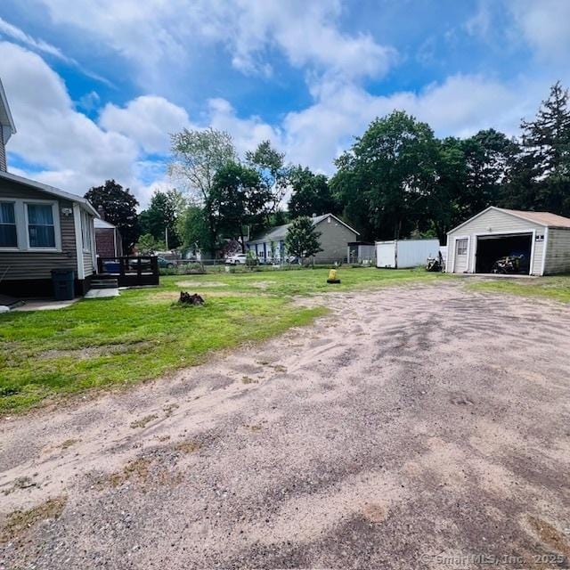 22 Webb St, Hamden, CT 06517 - view of yard featuring a detached garage and an outbuilding