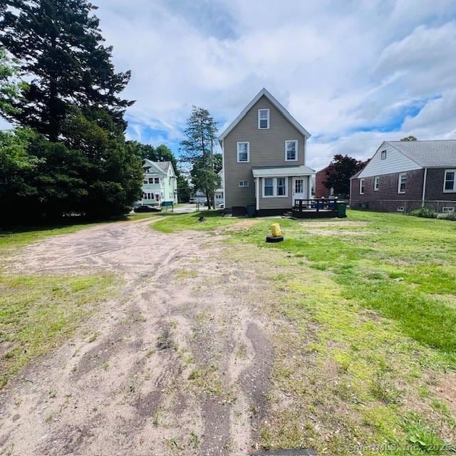 22 Webb St, Hamden, CT 06517 - back of house featuring dirt driveway and a yard