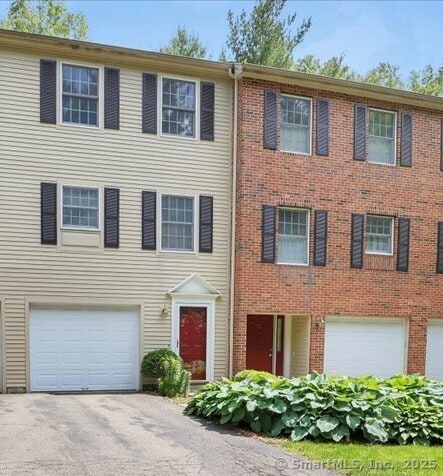 10 Crown Rdg Unit 10, Newington, CT 06111 - view of front of home with a garage and driveway
