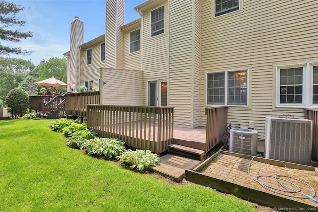 10 Crown Rdg Unit 10, Newington, CT 06111 - back of property featuring cooling unit, a yard, a wooden deck, and a chimney