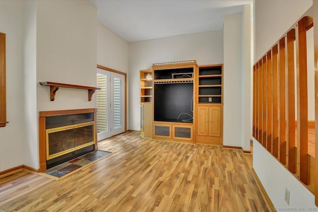 10 Crown Rdg Unit 10, Newington, CT 06111 - unfurnished living room with wood finished floors, baseboards, and a fireplace with flush hearth