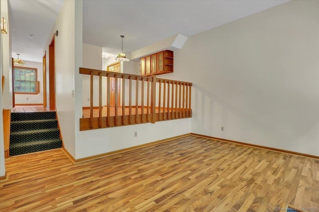 10 Crown Rdg Unit 10, Newington, CT 06111 - empty room featuring wood finished floors, baseboards, and a chandelier