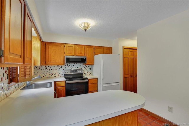 10 Crown Rdg Unit 10, Newington, CT 06111 - kitchen with range with electric cooktop, stainless steel microwave, freestanding refrigerator, a sink, and tasteful backsplash
