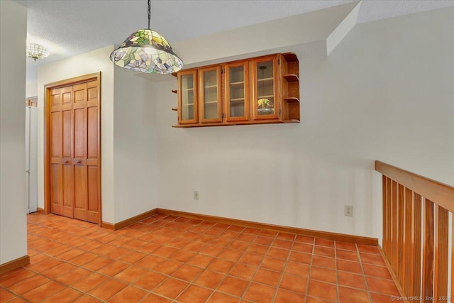 10 Crown Rdg Unit 10, Newington, CT 06111 - unfurnished room featuring baseboards, light tile patterned floors, and a textured ceiling
