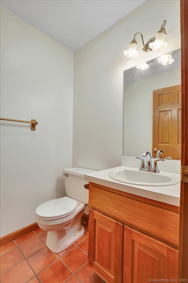 10 Crown Rdg Unit 10, Newington, CT 06111 - bathroom featuring vanity, toilet, tile patterned floors, and baseboards