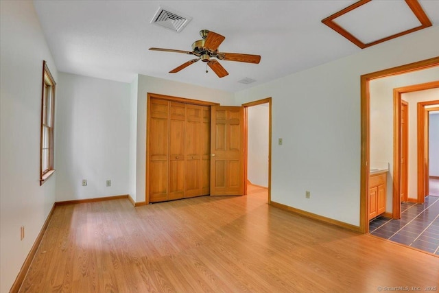 10 Crown Rdg Unit 10, Newington, CT 06111 - unfurnished bedroom with wood finished floors, baseboards, a closet, and ceiling fan