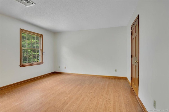 10 Crown Rdg Unit 10, Newington, CT 06111 - spare room featuring light wood-style flooring, a textured ceiling, and baseboards