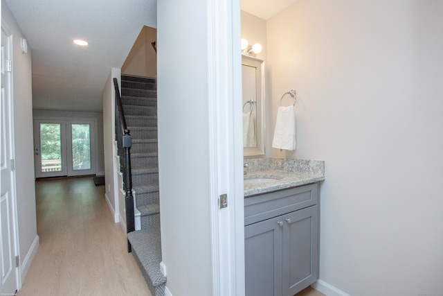 14 Hubbard Run Dr Unit 14, Glastonbury, CT 06033 - bathroom with wood finished floors, baseboards, vanity, and recessed lighting