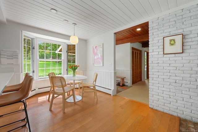 58 Lantern Ridge Rd, New Canaan, CT 06840 - dining area with wooden ceiling, hardwood / wood-style floors, a wainscoted wall, and a baseboard heating unit