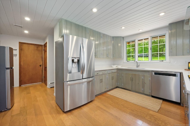 58 Lantern Ridge Rd, New Canaan, CT 06840 - kitchen featuring appliances with stainless steel finishes, a sink, light wood finished floors, recessed lighting, and light countertops