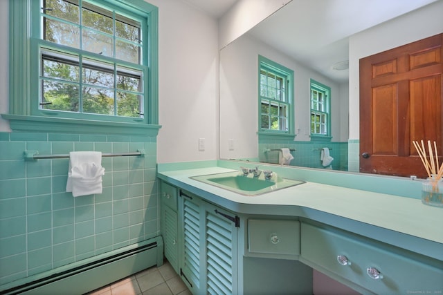 58 Lantern Ridge Rd, New Canaan, CT 06840 - bathroom featuring baseboard heating, tile patterned floors, vanity, tile walls, and wainscoting