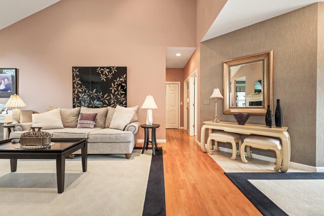 136 Thistle Pond Dr Unit 136, Bloomfield, CT 06002 - living area with wood finished floors, baseboards, high vaulted ceiling, and recessed lighting