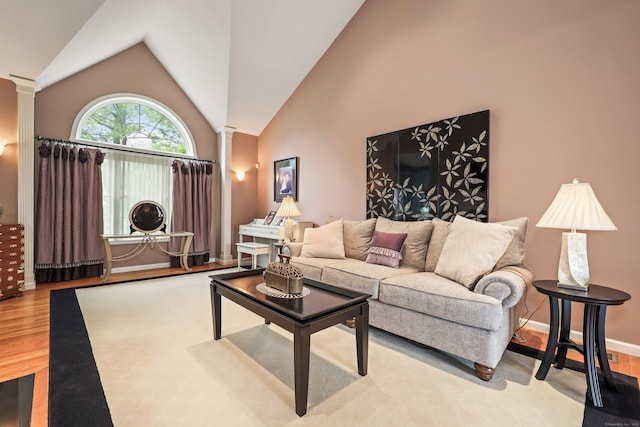 136 Thistle Pond Dr Unit 136, Bloomfield, CT 06002 - living area featuring ornate columns, wood finished floors, and lofted ceiling