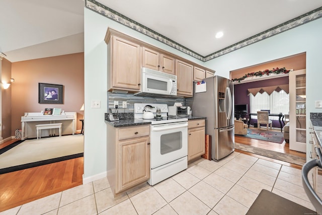 136 Thistle Pond Dr Unit 136, Bloomfield, CT 06002 - kitchen with white appliances, light tile patterned floors, light brown cabinets, and dark countertops