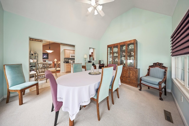 136 Thistle Pond Dr Unit 136, Bloomfield, CT 06002 - dining room featuring a ceiling fan, light carpet, high vaulted ceiling, and baseboards
