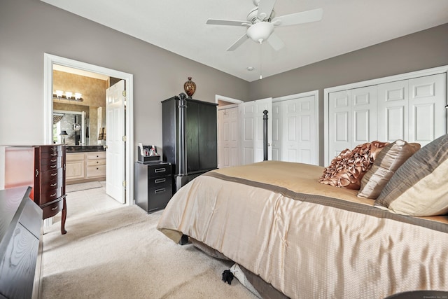 136 Thistle Pond Dr Unit 136, Bloomfield, CT 06002 - bedroom with multiple closets, light carpet, connected bathroom, and a ceiling fan