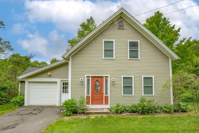 407 Monson Rd, Wilbraham, MA 01095 - view of front of home featuring an attached garage, asphalt driveway, and a front lawn