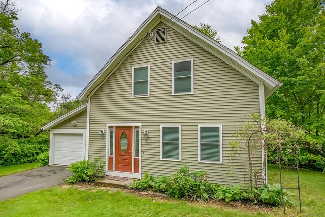 407 Monson Rd, Wilbraham, MA 01095 - view of front of property featuring asphalt driveway, an attached garage, and a front lawn