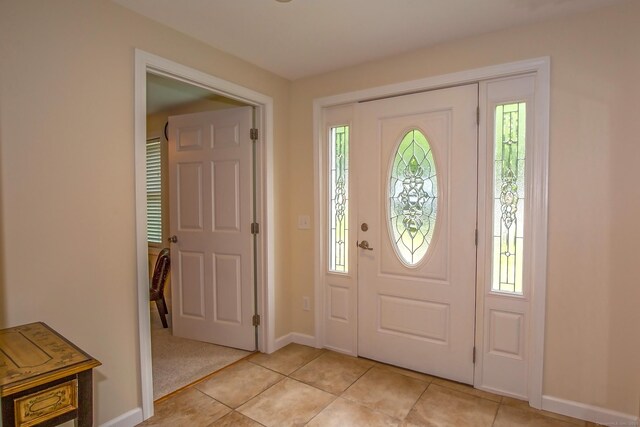 407 Monson Rd, Wilbraham, MA 01095 - foyer entrance featuring light tile patterned floors and baseboards