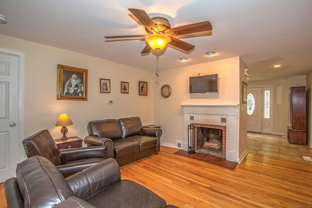 407 Monson Rd, Wilbraham, MA 01095 - living room with light wood finished floors, ceiling fan, a brick fireplace, and recessed lighting
