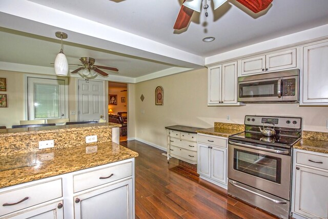 407 Monson Rd, Wilbraham, MA 01095 - kitchen featuring stainless steel appliances, ceiling fan, stone counters, and dark wood-style flooring