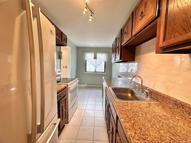 2 Briar Ct Unit 2, Cromwell, CT 06416 - kitchen with white appliances, a sink, baseboard heating, decorative backsplash, and light tile patterned floors