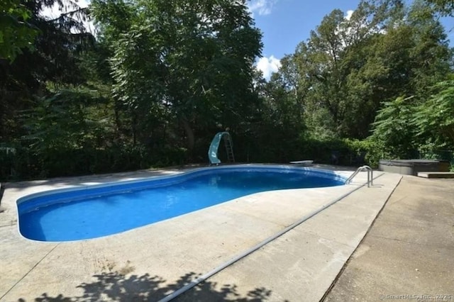 240 Mountain Spring Rd, Tolland, CT 06084 - swimming pool featuring a water slide, a patio area, and a diving board