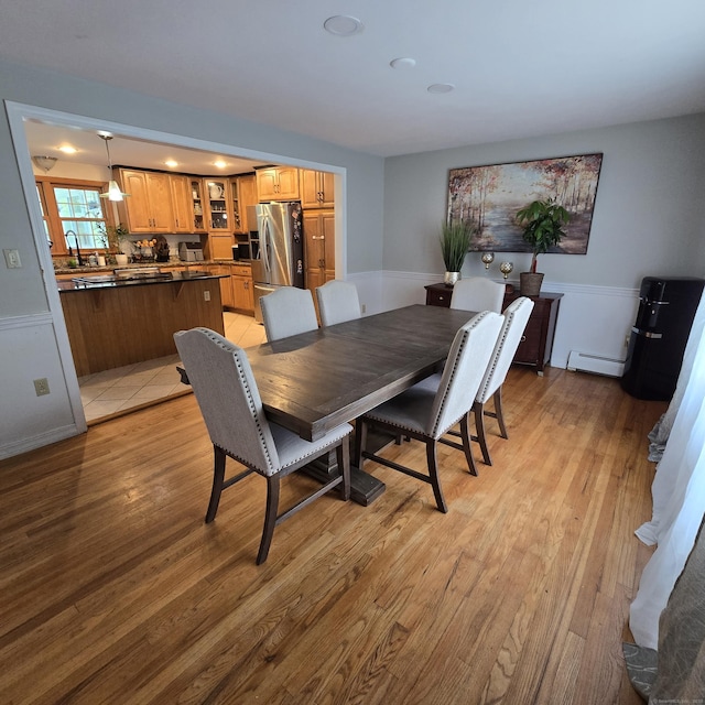 240 Mountain Spring Rd, Tolland, CT 06084 - dining room with baseboard heating and light wood-type flooring