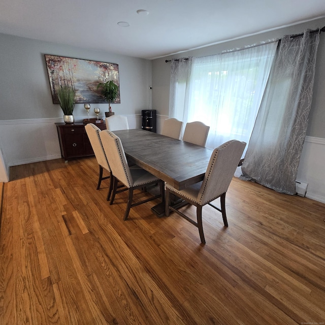 240 Mountain Spring Rd, Tolland, CT 06084 - dining area with wood finished floors, a baseboard heating unit, and baseboards