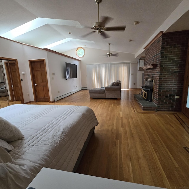 240 Mountain Spring Rd, Tolland, CT 06084 - bedroom with vaulted ceiling, wood finished floors, baseboard heating, baseboards, and a skylight