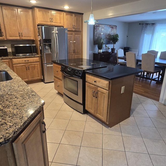 240 Mountain Spring Rd, Tolland, CT 06084 - kitchen with stainless steel appliances, light tile patterned flooring, dark stone countertops, hanging light fixtures, and a kitchen island