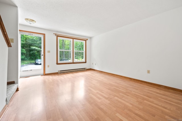 147 Julia Ter Unit 147, Middletown, CT 06457 - unfurnished living room with baseboard heating, light wood-type flooring, and baseboards
