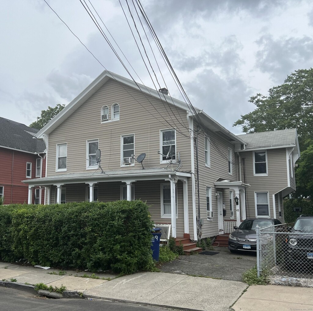39 Harral Ave, Bridgeport, CT 06604 - view of front of property featuring a porch and asphalt driveway