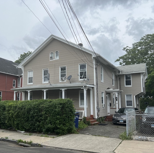 39 Harral Ave, Bridgeport, CT 06604 - view of front of property featuring a porch and asphalt driveway