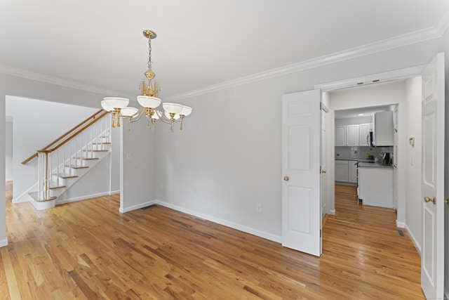 8 Stone Gate Dr, Newtown, CT 06482 - unfurnished room with a chandelier, stairs, light wood-style floors, and ornamental molding
