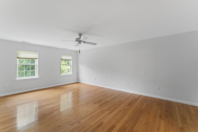 8 Stone Gate Dr, Newtown, CT 06482 - empty room featuring a ceiling fan and light wood finished floors
