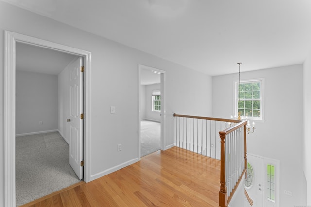 8 Stone Gate Dr, Newtown, CT 06482 - hallway featuring healthy amount of natural light, light wood-style floors, and an upstairs landing