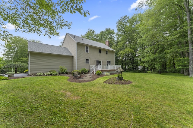 8 Stone Gate Dr, Newtown, CT 06482 - rear view of house featuring a deck, a yard, a chimney, and a fire pit