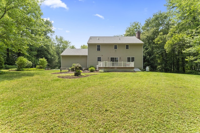 8 Stone Gate Dr, Newtown, CT 06482 - back of property featuring a deck, a chimney, and a lawn